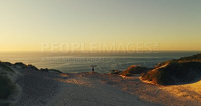 Buy stock photo Aerial view, bicycle and man with celebration for sunset, travel or fitness for journey and achievement. Person, cycling and horizon for exercise, eco tourism and nature space for holiday or vacation