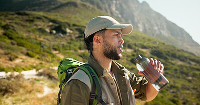 Buy stock photo Mountain, water break and man with bottle for hiking pause, hydration and refreshing drink for workout. Outdoor, wellness and person relax on sightseeing trip, summer trekking and thirsty for liquid
