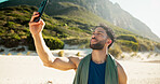 Happy man, fitness and beach with selfie for photography, memory or capture moment in nature. Active, male person or smile with mobile smartphone for picture, social media or post on ocean coast