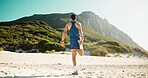 Man, fitness and stretching legs at beach with back for healthy muscle, circulation or training. Person, runner and warm up for flexibility, exercise and outdoor in summer with balance in morning