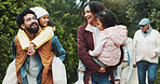 Family, children and walk at park, excited and piggyback with happy for sightseeing, holiday and bonding. People, parents and grandparents with kids, vacation or outdoor together at urban garden