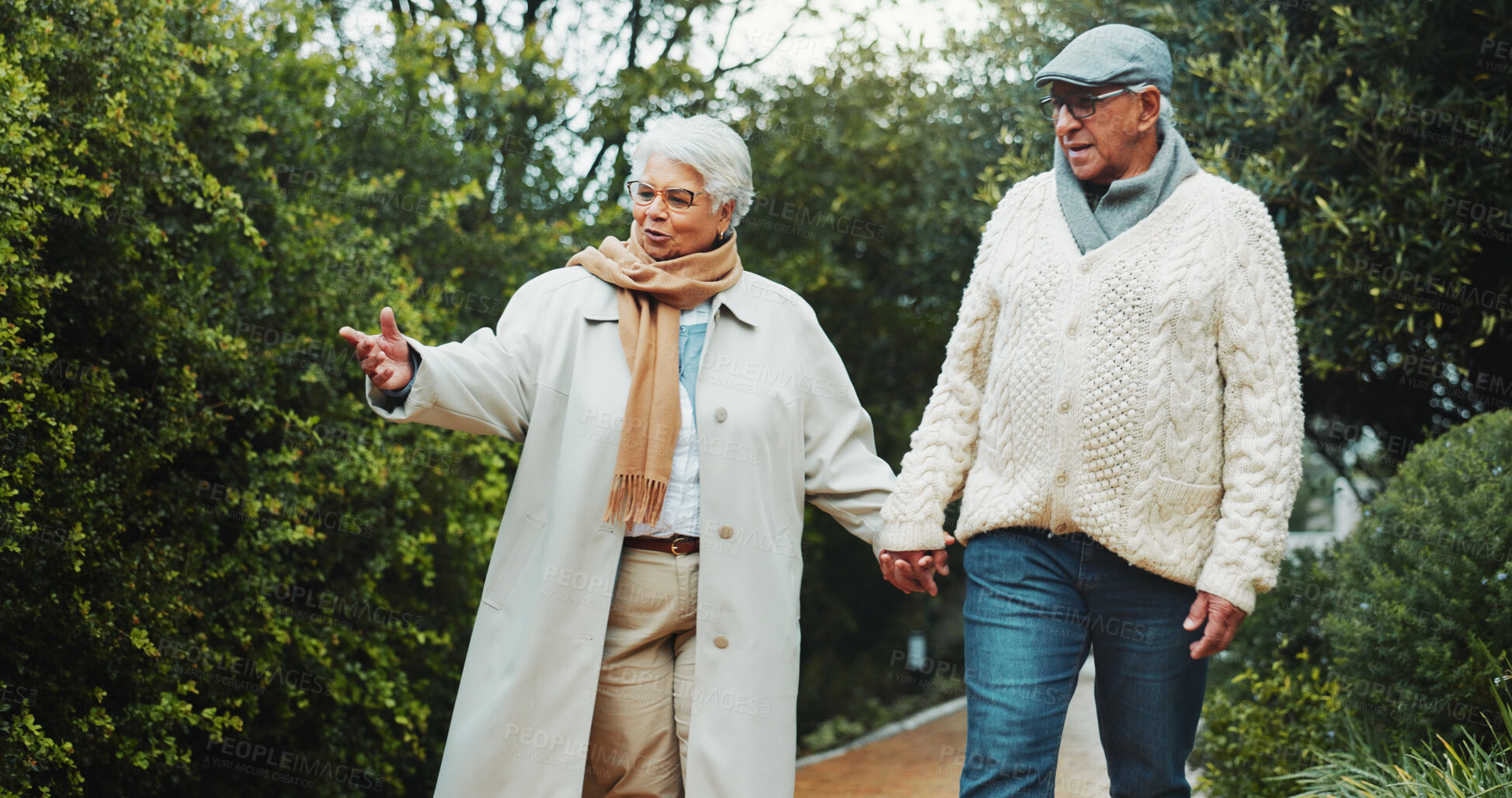 Buy stock photo Holding hands, walking and senior couple in garden with bonding together on holiday, getaway or adventure. Happy, support and elderly man with woman outdoor for connection, love or marriage in nature