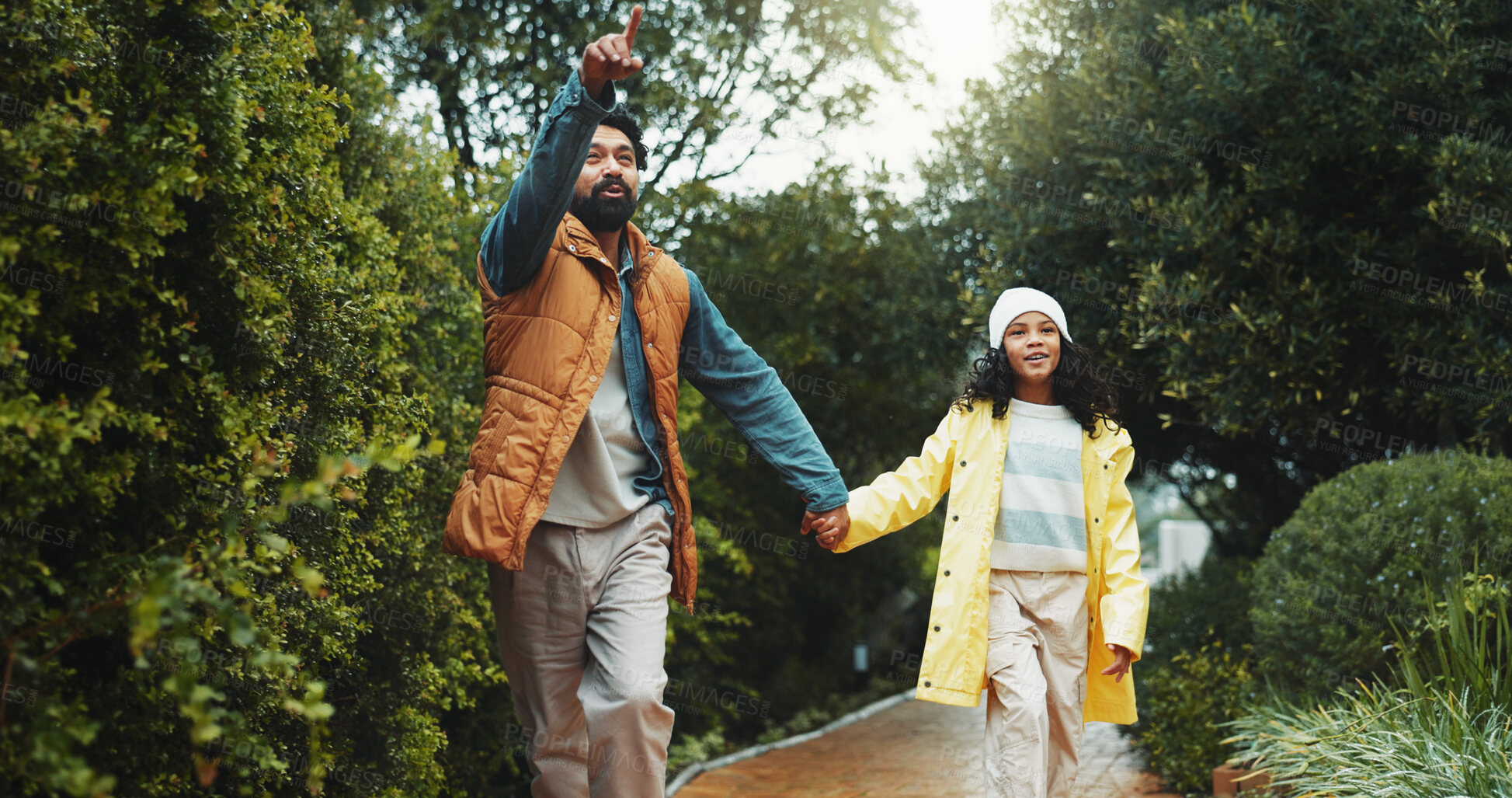 Buy stock photo Holding hands, outdoor or father with girl on path for holiday, connection or pointing for care. Support, travel trip or man walk with child to explore park, winter vacation or sightseeing together