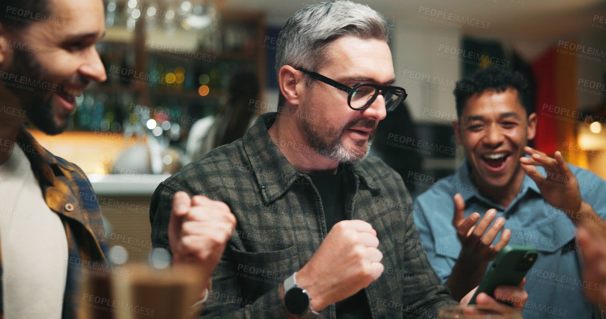 Buy stock photo Phone, cheering and men in pub for sports game with goal, victory or winning championship. Happy, cellphone and group of male friends with celebration for watching football match in bar together.
