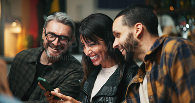 Buy stock photo Smartphone, people and friends in pub, smile and social media with communication. Men, online humor and cellphone with internet, connection and digital app with website info, funny meme and happiness