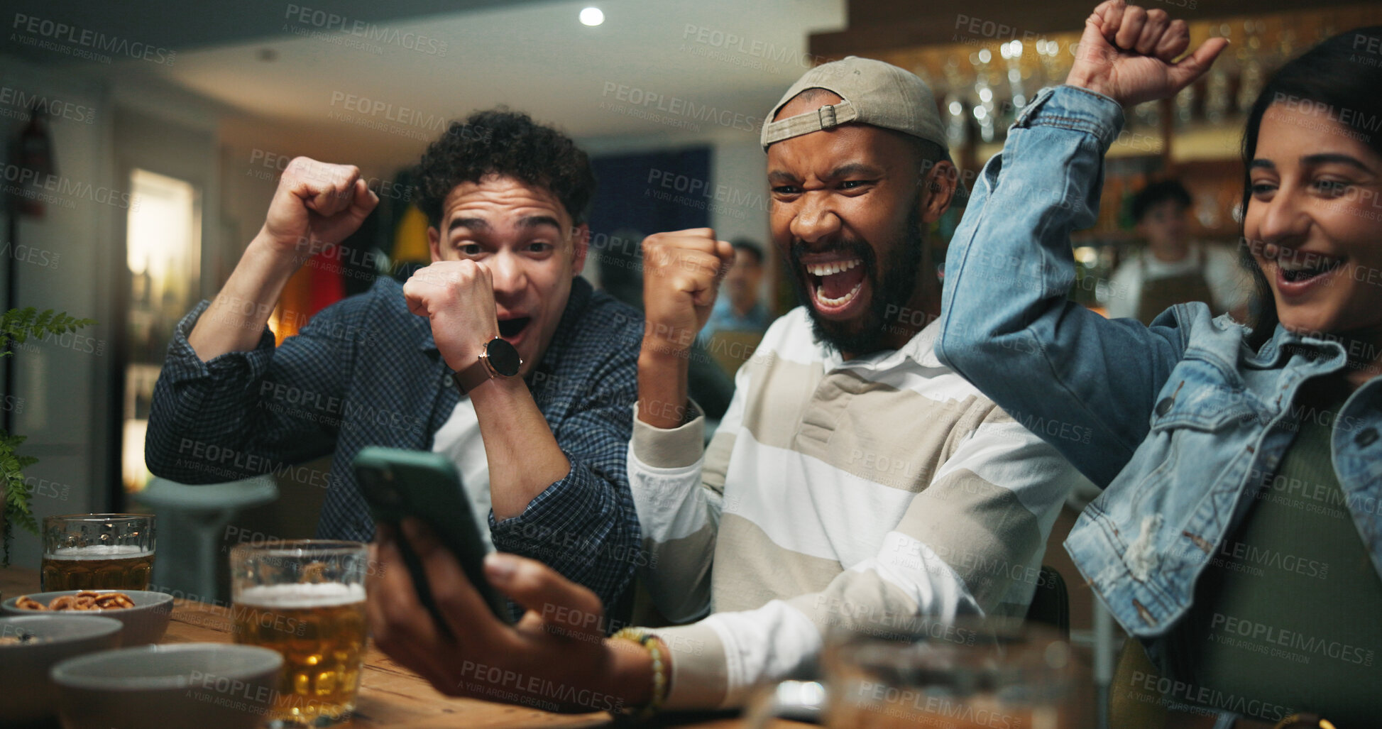 Buy stock photo Cellphone, cheering and men in pub for sports game with goal, victory or winning championship. Happy, phone and group of male friends with celebration for watching football match in bar together.