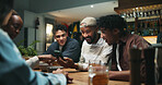 Relax, friends and drinks with phone in pub for streaming sports match, live broadcast and bonding. Football fans, people or smartphone with beer in bar for watching online game, support or night out