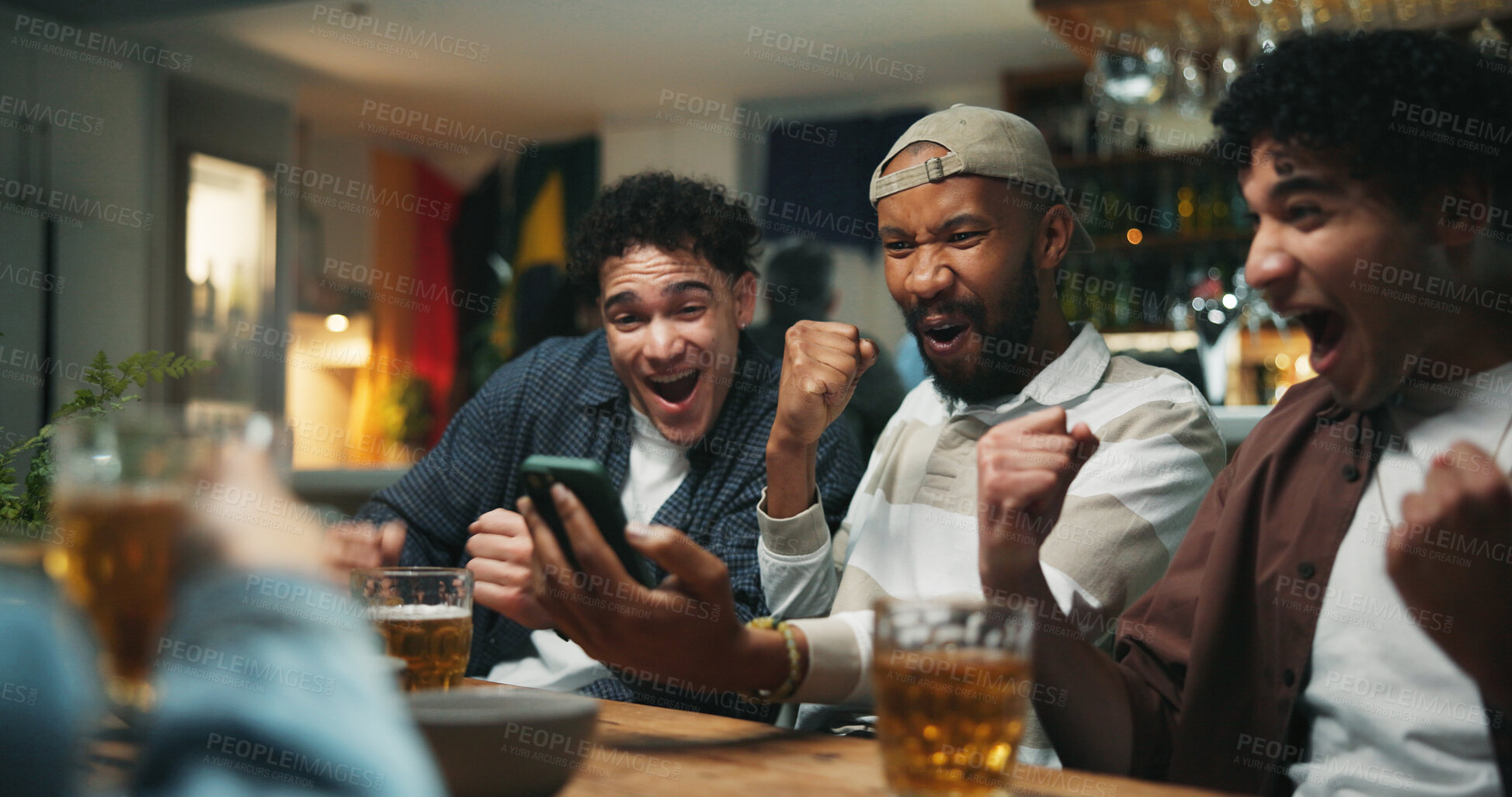 Buy stock photo Phone, cheering and friends in pub for sports game with goal, victory or winning championship. Happy, cellphone and group of male fans with celebration for watching football match in bar together.