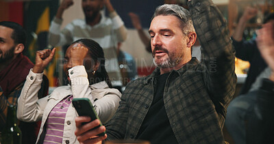 Buy stock photo Winning, man and celebration with phone in pub for streaming match, sports goal or team support. Football fans, mature person or mobile app in bar for online game score, live results or viewing party