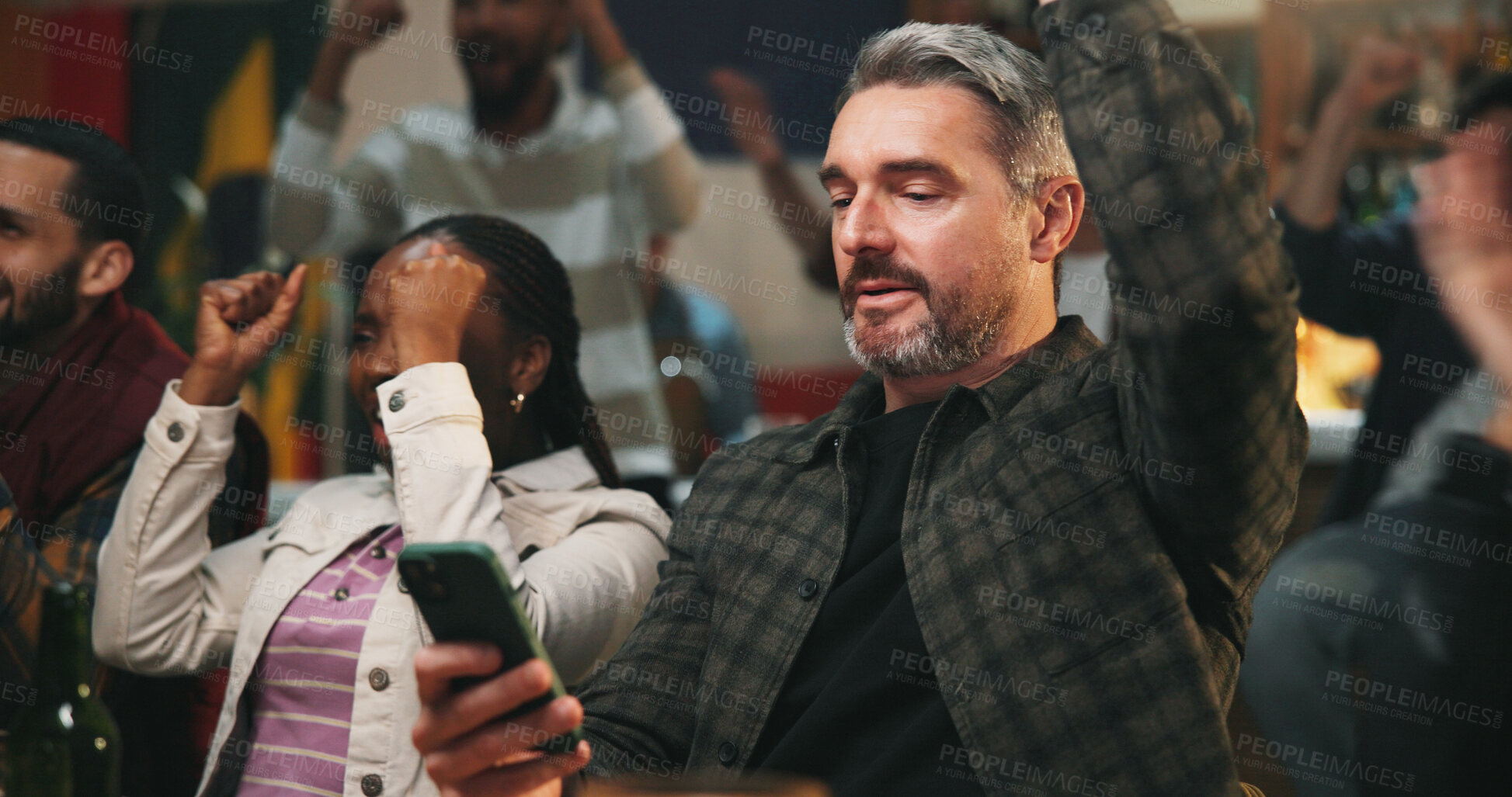 Buy stock photo Winning, man and celebration with phone in pub for streaming match, sports goal or team support. Football fans, mature person or mobile app in bar for online game score, live results or viewing party