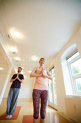 Buy stock photo Yoga, people and smile in class with prayer hands for spiritual awareness, chakra healing and low angle. Happy, friends and mudra in gym studio with namaste pose for gratitude, mindfulness and space.