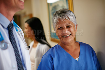 Buy stock photo Woman, smile and nurse in hospital for healthcare, medical experience and ready for consultation. Mature specialist, happy or portrait in clinic with team, service or opportunity for doctor assistant