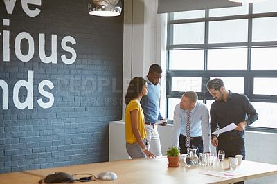 Buy stock photo Business people, team and discussion at office meeting, paperwork and insight for risk management. Group, men and woman with problem solving, review and feedback for project at insurance agency