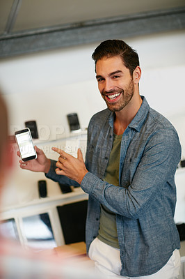 Buy stock photo Happy, creative and man with phone in office with idea for mobile app, ui design and website. Startup, meeting and worker with cellphone pointing to screen for software, digital interface or planning