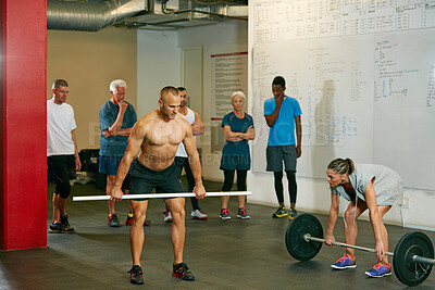 Buy stock photo Weightlifting, coach or class in gym for strength training, explain workout or practice deadlift. Form demonstration, mentoring or people with trainer for injury prevention, build muscle or fitness