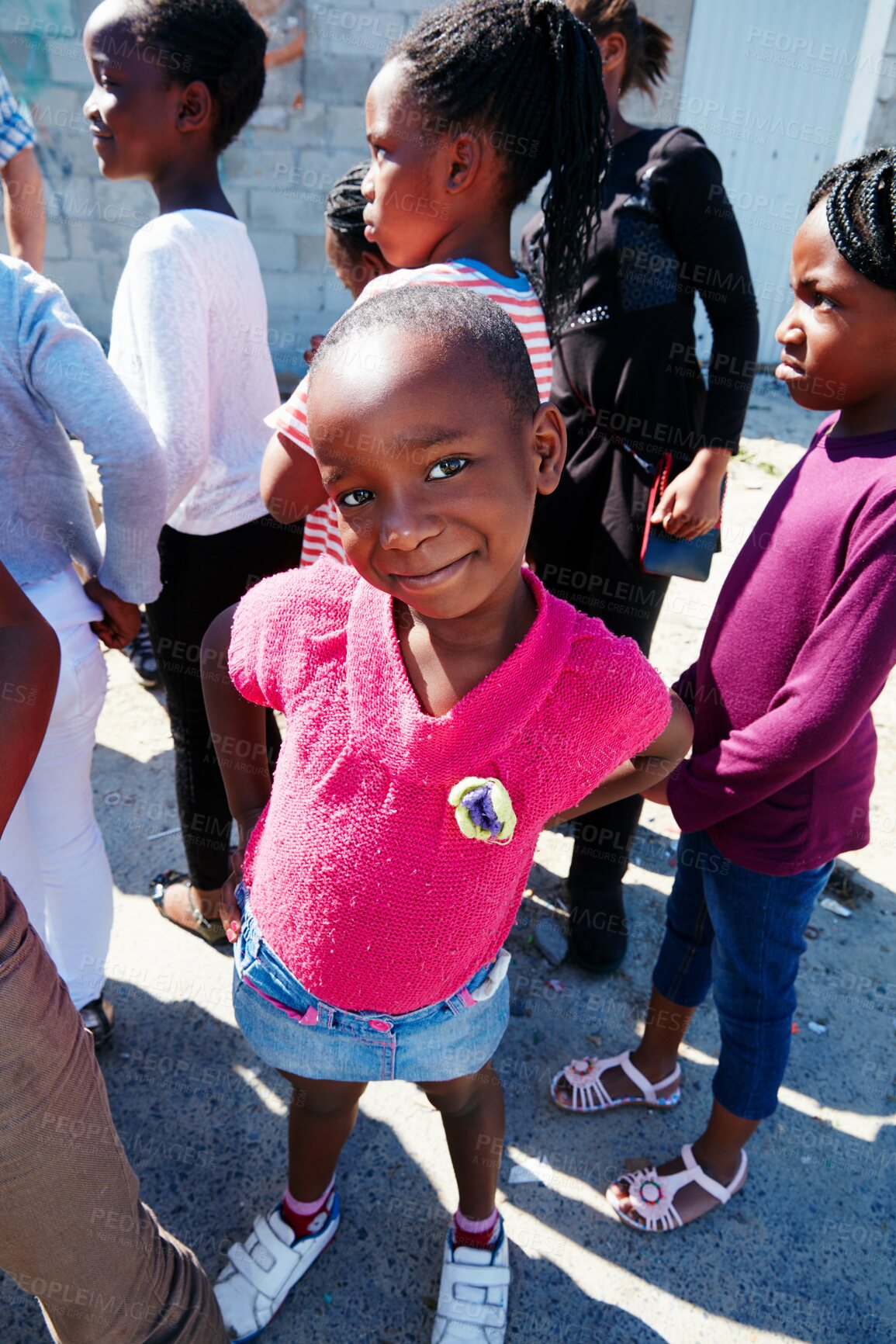 Buy stock photo Portrait, outreach and smile with child outdoor for education drive, community service and welfare project. Rural school program, student and social responsibility with group of kids in neighborhood