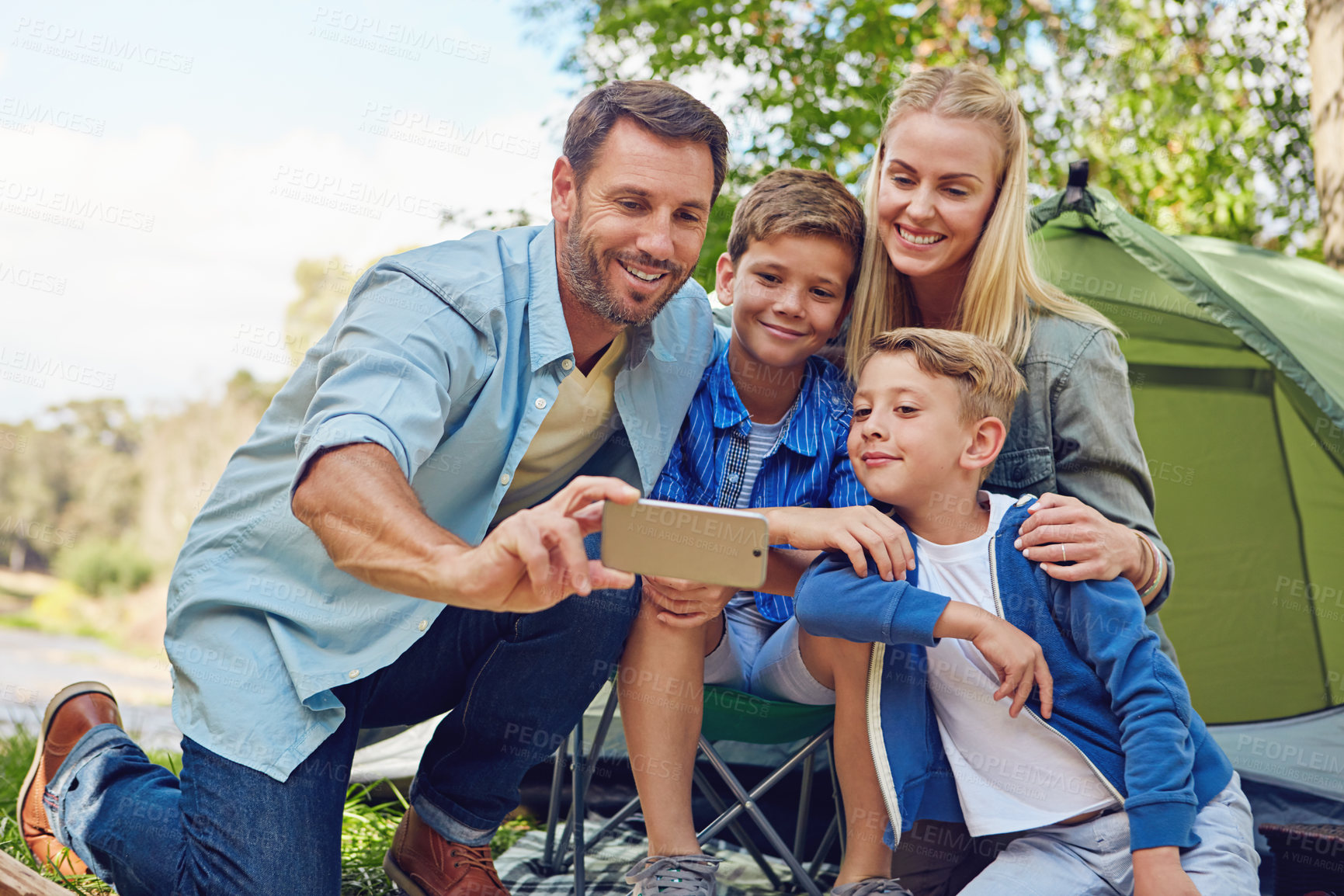 Buy stock photo Camping, holiday and selfie with family outdoor together for bonding, experience or travel. Photograph, tent or vacation with children and parent people at campsite in nature for weekend adventure