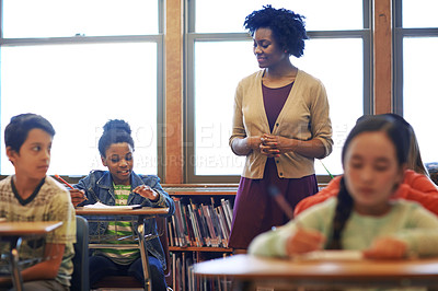 Buy stock photo Teacher, education and support with woman in classroom for child development, growth and knowledge. Lecture, learning and teaching with person and kids in school for lesson, academy and students