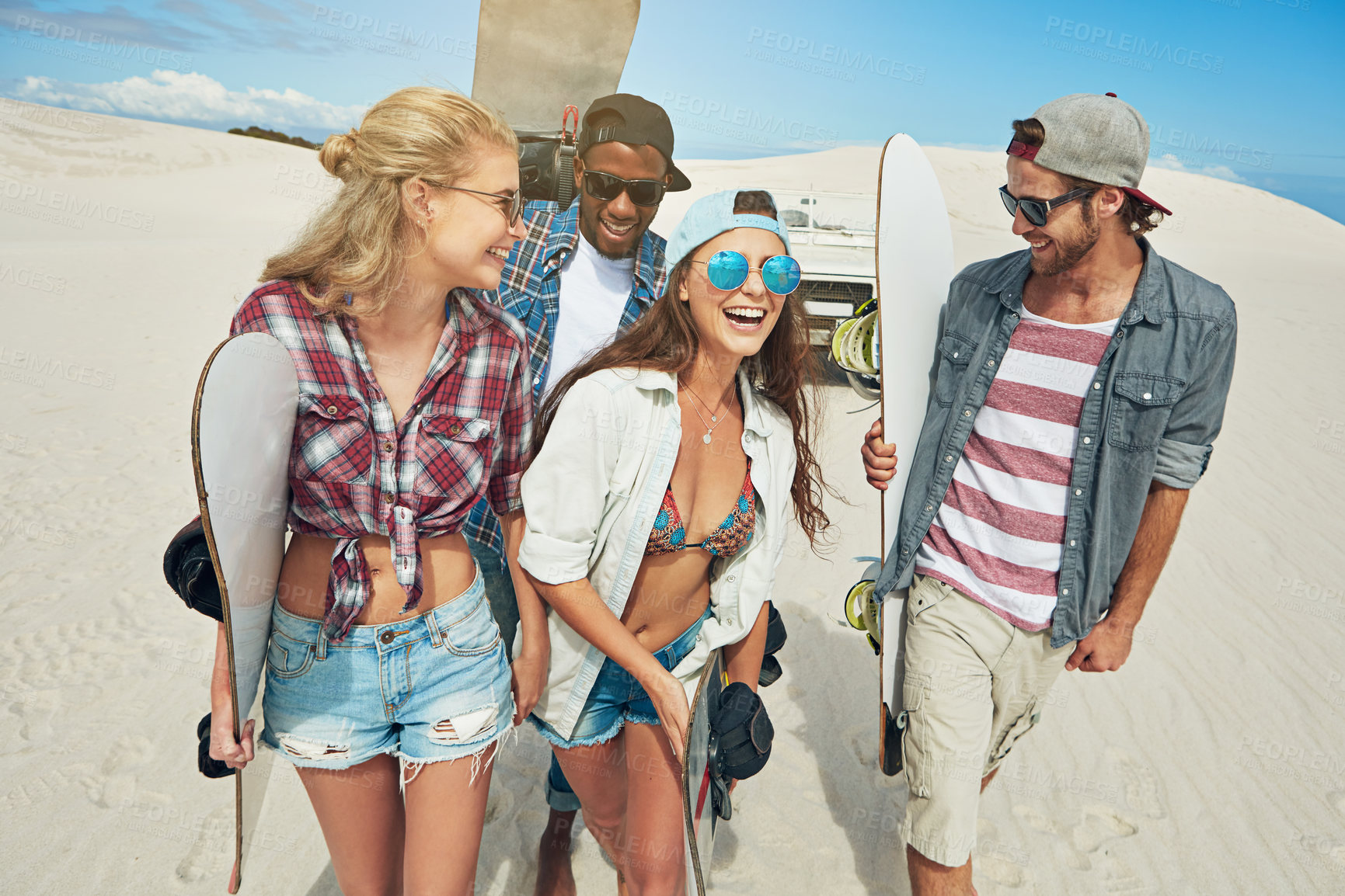 Buy stock photo Sand boarding, travel and laughing with friends in desert for adventure, hobby and fitness. Dune surfing, extreme sports and summer vacation with people outdoor for action, tourism and funny joke