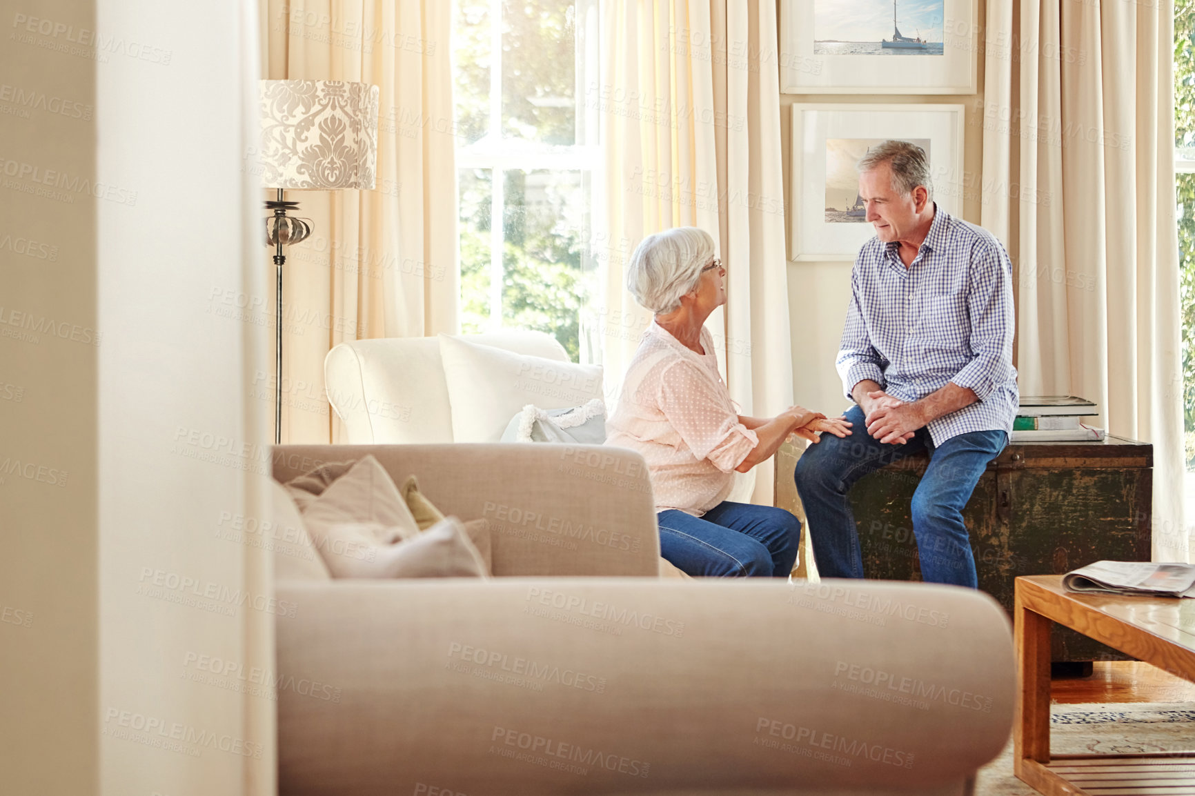 Buy stock photo Old couple, love and talking in home for bonding, relax and share marriage memories on sofa. Elderly man, woman and discussion in living room for retirement planning, conversation and support