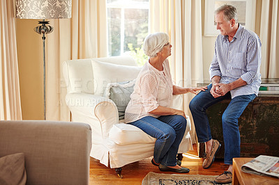 Buy stock photo Old couple, support or talking in home for love, relax or encouragement in retirement on sofa. Elderly man, woman or discussion in living room for pension planning, conversation or mental health care