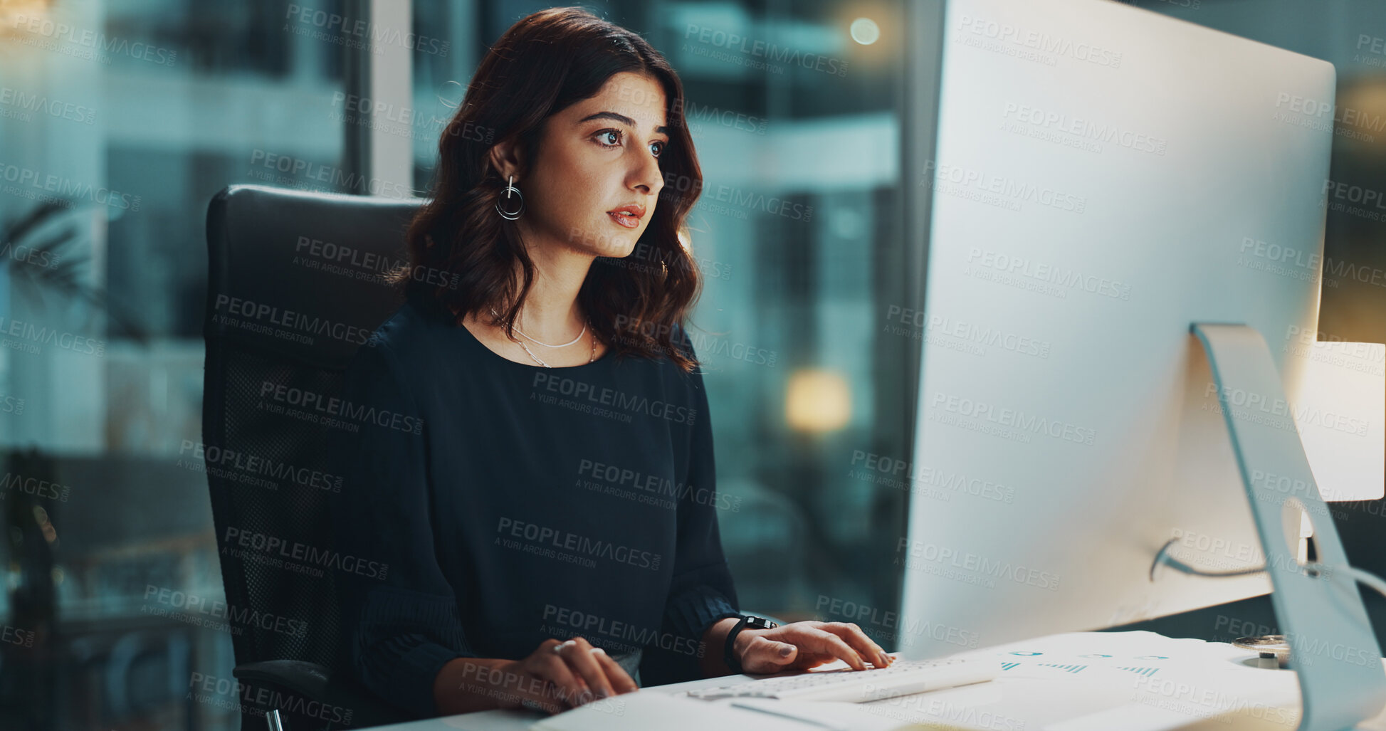 Buy stock photo Night, typing and woman in office with computer, business plan and ideas for financial project at digital agency. Research, overtime and consultant at desk checking email, tax report or sales review