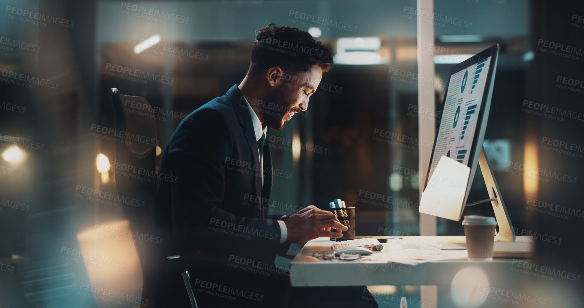Buy stock photo Night, happy man or typing at computer for business, research or planning report presentation with stats on screen. Accountant, tech and smile in dark office for results for company finance growth