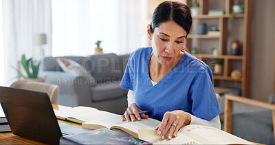 Buy stock photo Nurse, woman and studying with textbook by laptop for healthcare research, information or knowledge. Medical, work and reading with technology at desk for diagnosis reference, guide or treatment plan