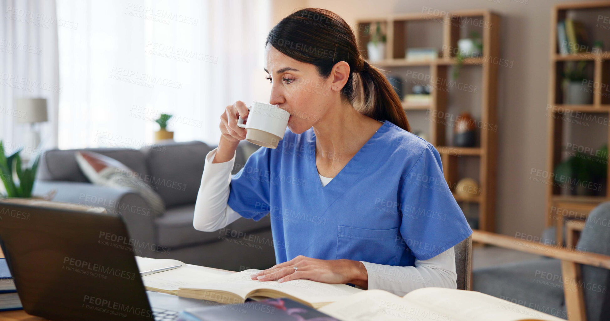Buy stock photo Nurse, woman and studying with coffee by laptop for medical research, information and knowledge. Healthcare, worker and textbook with beverage at desk for diagnosis reference, guide or treatment plan