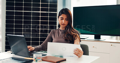 Buy stock photo Woman, reading and document with laptop in office for results, energy saving stats and sustainable. Person, pc and paperwork with photovoltaic grid revenue, company performance and solar panel sales