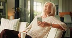 Home, smartphone and old woman on sofa, funny meme and internet social media. Apartment, happiness and mature person with cellphone, laughing and message to contact, smile and app for online humor