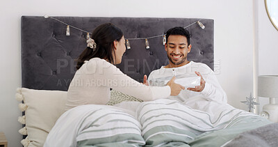 Buy stock photo Christmas, love or couple in bed with present, romantic moment or gratitude in xmas morning. Festive, happy or people in house with gift box, healthy relationship or appreciation in holiday tradition