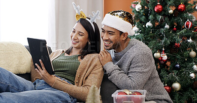 Buy stock photo Christmas, tablet and couple relax in home for gift shopping, search and decision online. Xmas, man and woman with tech in living room for holiday sale, e commerce and smile for festive discount