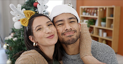 Buy stock photo Christmas, portrait and happy couple in house with selfie for holiday tradition, connection or embrace. Married people, hug or smile in home with pout for festive season, picture or bonding together.