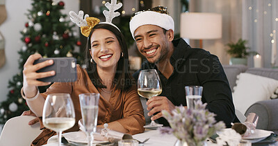 Buy stock photo Christmas, selfie or happy couple with wine in home, social media post or profile picture update. Festive holiday, celebration or people with photography at dinner table for memory, smile or alcohol