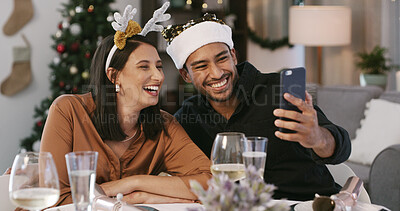 Buy stock photo Christmas, selfie or couple with smile in home, social media post or profile picture update. Festive holiday, celebration or people with photography at dinner table for memory, happiness or laugh