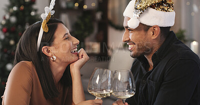 Buy stock photo Christmas, happy couple and cheers in home with wine for holiday tradition, connection and bonding. Married people, toast or celebration in living room with alcohol, smile or love for festive season.