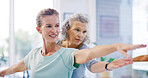Mature people, personal trainer and stretching with yoga for spiritual wellness or balance together. Senior women, yogi and fitness in warriors pose for warm up, mindfulness or retirement exercise