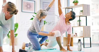 Buy stock photo Women, yoga and meditation in studio, help and support with wellness, awareness and chakra energy. People, instructor and teacher in health club, fitness and breathing with stretching, calm and coach