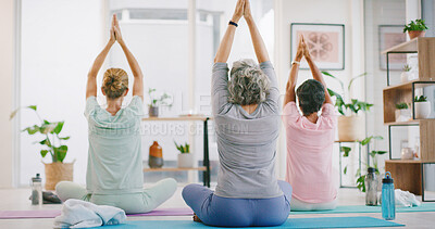 Buy stock photo Yoga, back and class with women in studio for meditation, spiritual balance and fitness. Mindfulness, chakra and peace with group of people in wellness club for holistic healing, prayer pose or relax
