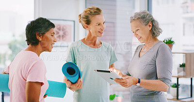 Buy stock photo Yoga class, tablet or mature people in studio, check registration information or digital enrolment. Membership, yogi or women with tech to review sign up sheet, online record and application form