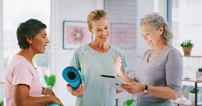 Buy stock photo Yoga class, tablet and yogi with people in studio, check registration info or digital enrolment. Membership, smile or mature women with tech to review sign up sheet, online record or application form
