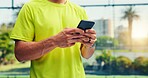 Cellphone, fitness and hands of man on court with networking, communication or texting on mobile app. Technology, sports and male athlete with typing on phone for chatting, contact or social media.