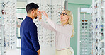 Optometry, choice or people in store with glasses, variety or assistance in eyewear option. Healthcare, frames or optometrist in shop with specs, eye wellness or optical decision in customer service.