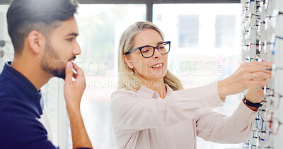 Buy stock photo Eye care, man and shopping for glasses with optometrist, vision and thinking of choice. Store, eyewear and person with optician for help, optometry advice and customer with lens for health decision