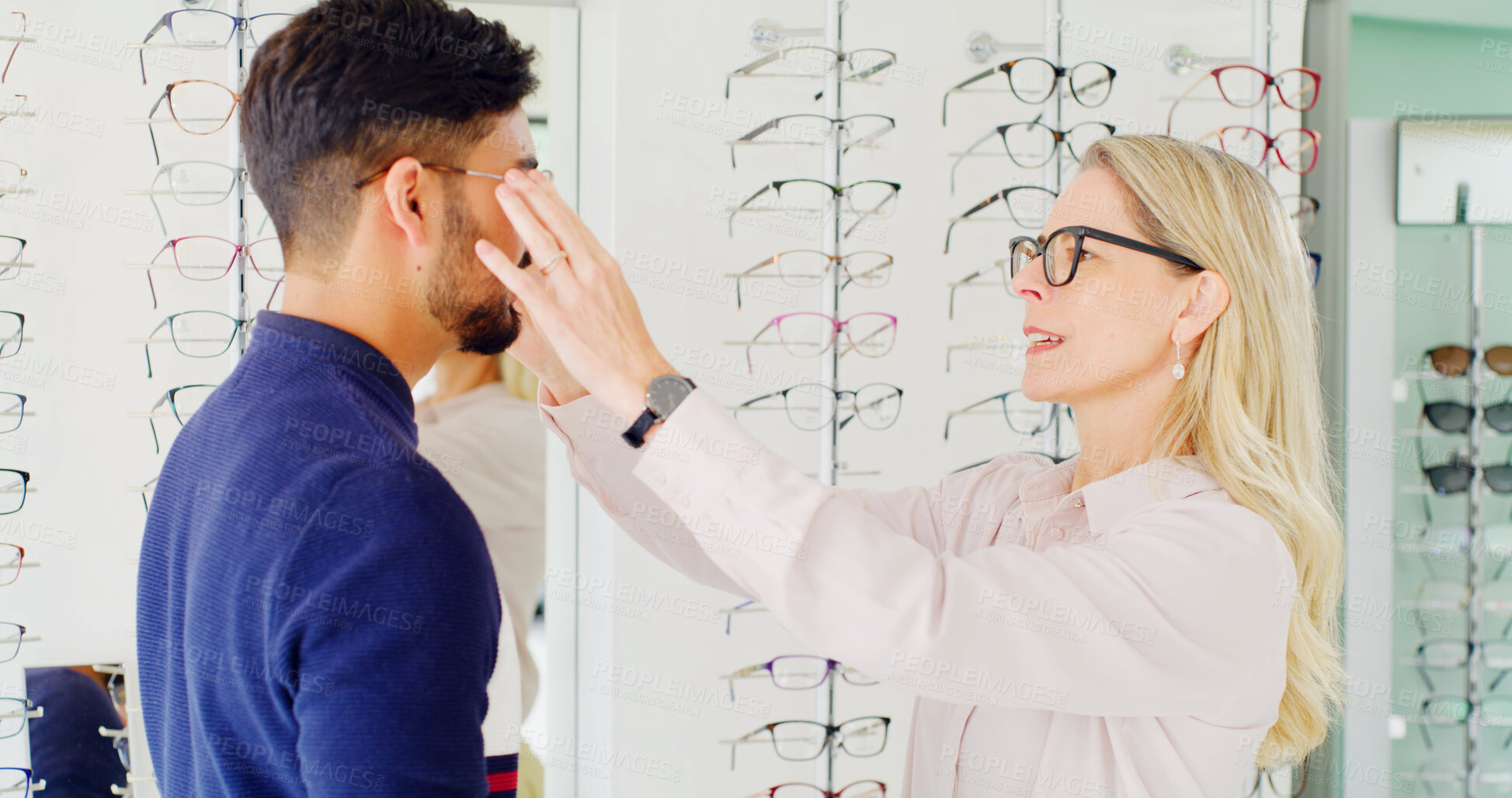 Buy stock photo Optometry, option or people in shop with glasses, variety or assistance in eyewear decision. Healthcare, frames or optometrist in store with specs, eye wellness or optical choice in customer service.