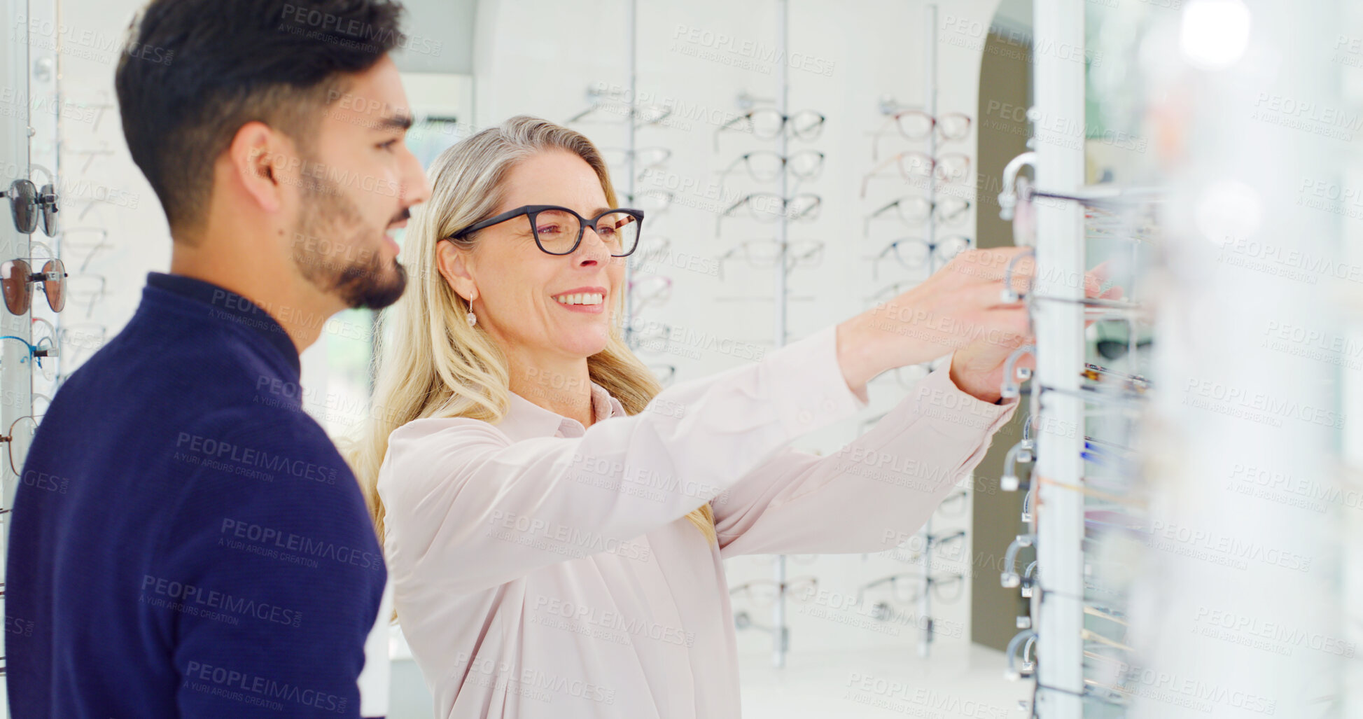 Buy stock photo Health, man and shopping for glasses with optician, vision or assistance with choice for eye care. Store, eyewear or person with optometrist for help, optometry or happy client with prescription lens