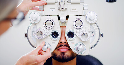 Buy stock photo Optometrist, man or patient with eye exam machine, vision test or determine prescription for clear sight. Assessment, optometry or people with lens selection on phoropter, consultation or portrait