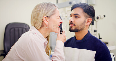 Buy stock photo Optometrist, man and consultation with light, tools and clear vision exam with healthcare. Medical service, ophthalmologist and patient with appointment, ophthalmoscope or lens test with prescription