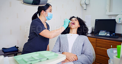 Buy stock photo Dentist, women and inspection with mouth mirror for teeth assessment, oral exam and appointment in office. Dental care, specialist and client with tools for cavity check, gum health and consultation